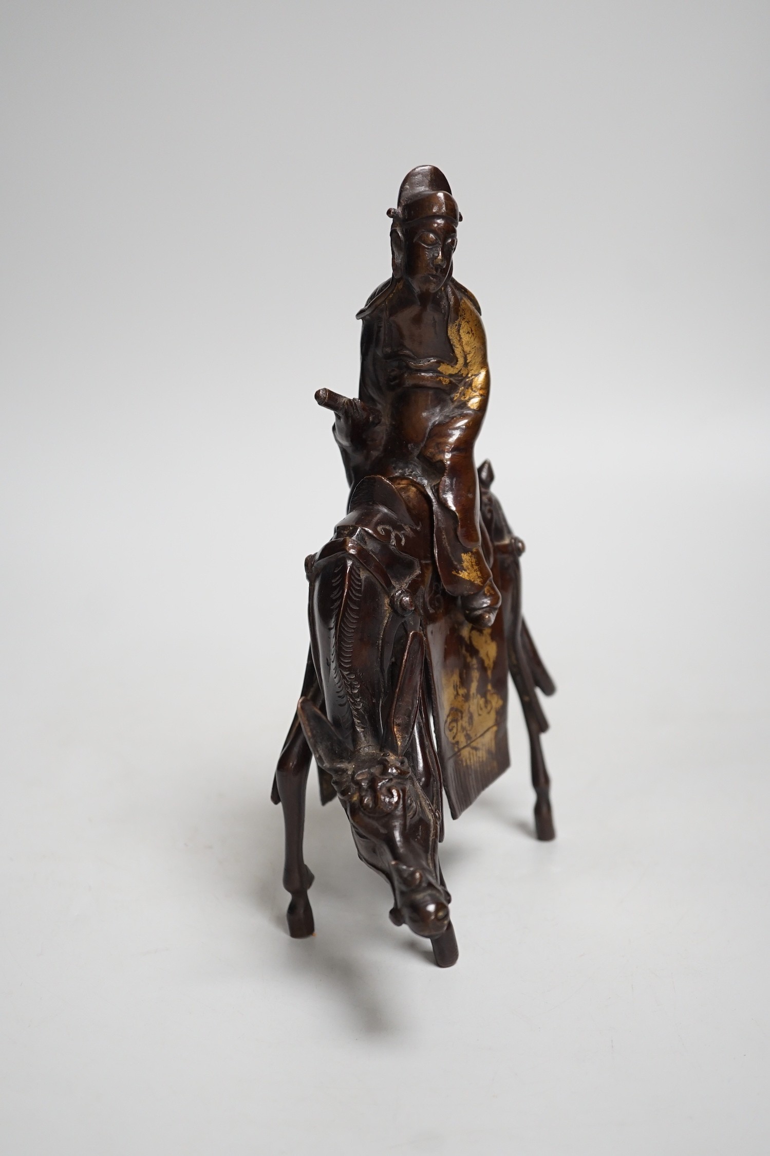 A Chinese late Ming bronze censer of an official riding a horse, 23cm